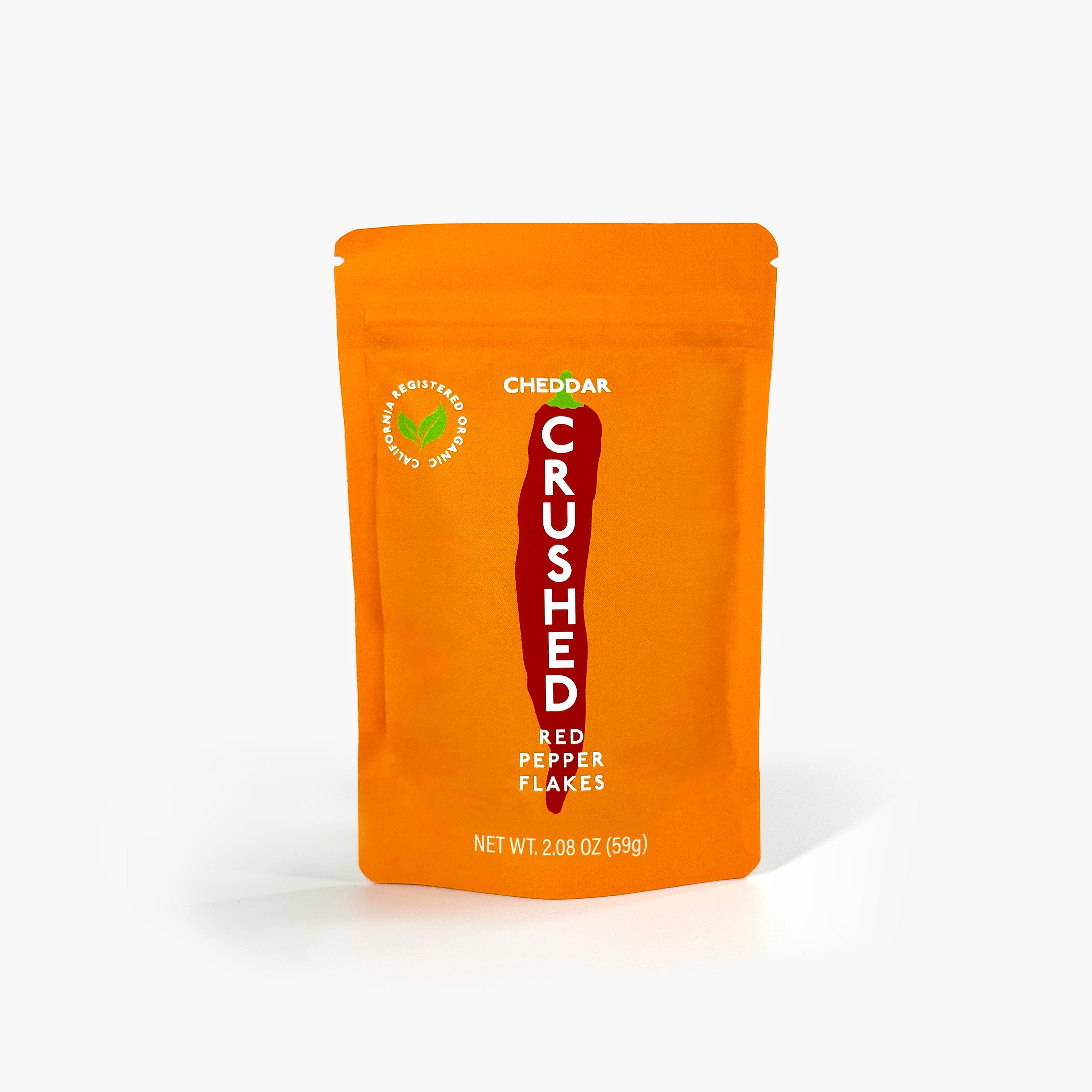 Orange refill pouch of Cheddar Crushed Red Pepper Flakes on a white background