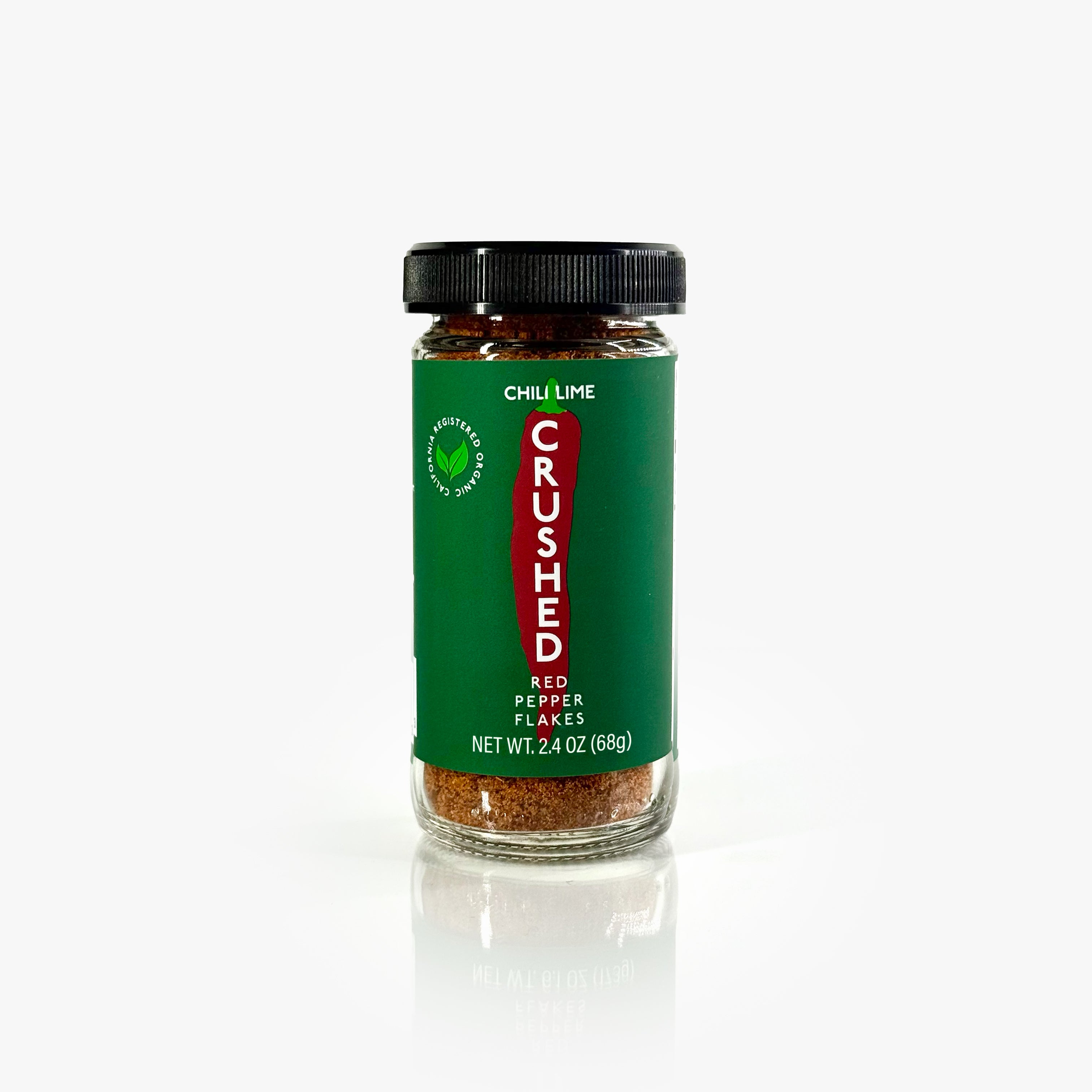 Jar of  Chili Lime Crushed Red Pepper Flakes on a white background.