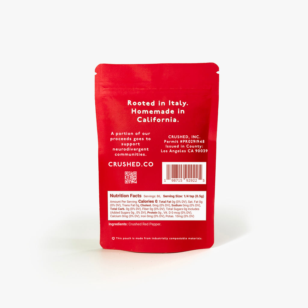 Red refill pouch of Original Crushed Red Pepper Flakes on a white background wiht nutritional information and ingredients.